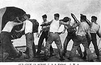 Photo # NH 103303: Gun crew in action on board USS Finland